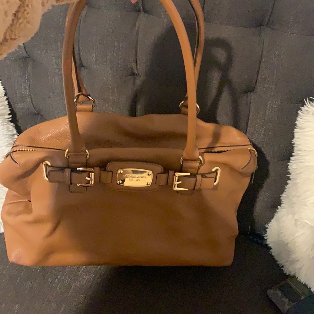 I am selling a brown, leather Michael Kors bag